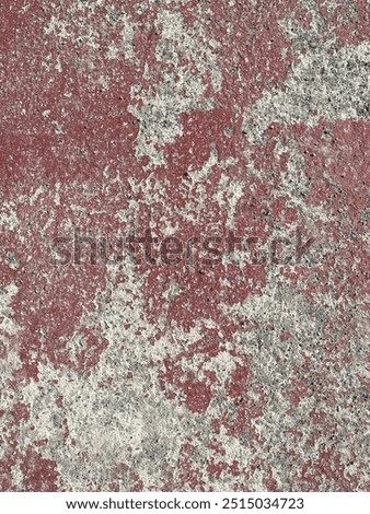 Concrete with a red and white pattern. The concrete is old and has a rough texture. The red and white pattern is faded and worn.