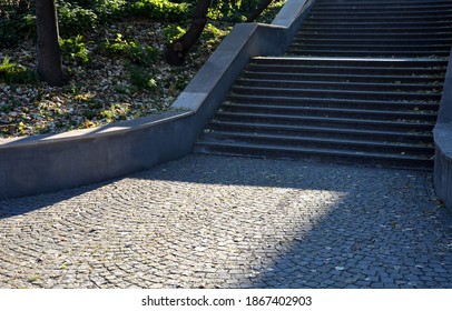 Concrete Retaining Wall At The Large Staircase In The Park The Flowerbed Area Is Planted With Rich Greenery Of Perennials Granite Paving Of Cube