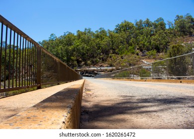 Concrete Road Over The Rocks To View The Massive Concrete Wall And Slipway  Of Wellington Dam Near Collie Western Australia On A Fine Morning In Summer Is One Way Traffic Only.