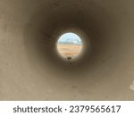 Concrete sewer pipe. Texture concept of tunnel with light at the end. Interior of sewage tunnel
. Bore well, drainage, pipeline, mining and factory sewage concept.