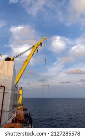 A concrete sleeper being lifted from a construction work barge for installation at offshore oil field