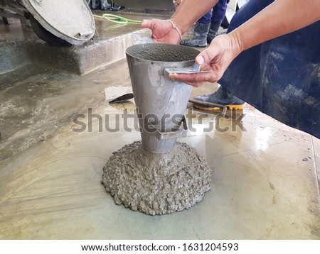 The concrete slump test checking in lab to determine work-ability of fresh concrete