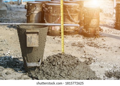 Concrete Slump Testing of mixing concrete checking workability in field construction site 