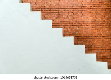 Concrete Staircase with brick wall in residential house building of construction industry - side view
