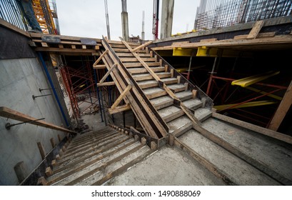 concrete stairwells and scaffolding at a construction site - Powered by Shutterstock