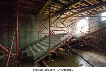 concrete stairwells and scaffolding at a construction site - Powered by Shutterstock