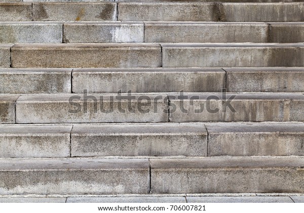 concrete steps on the street. photo close-up from\
the side. Details of the structure, where the steps are divided\
into plates