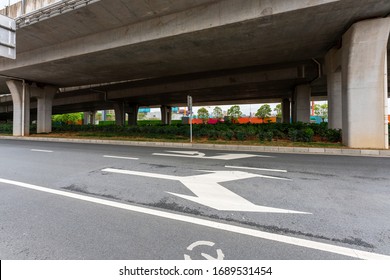 Concrete structure and asphalt road space under the overpass in the city - Shutterstock ID 1689531454