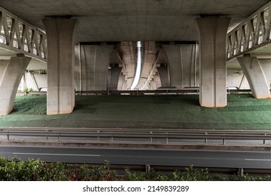Concrete structure and asphalt road space under the overpass in the city - Shutterstock ID 2149839289