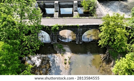 A concrete structure built in the middle of the forest.