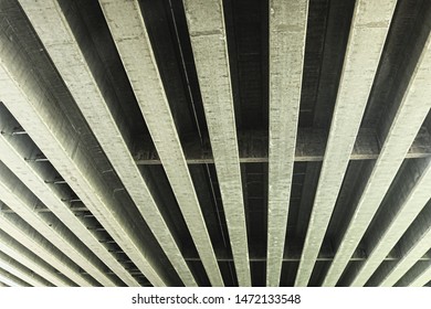 concrete struts on the underside of an interstate bridge
