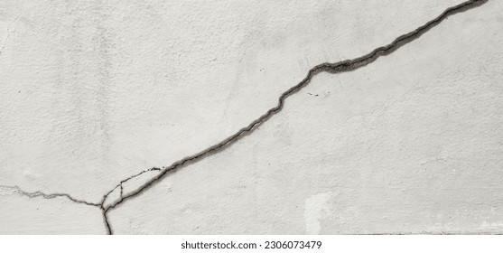 Concrete that cracks buildings or walls leading to obvious crevices. Cracks in the cement wall until a long split is visible. This could be due to improper mortar mix or soil subsidence. 