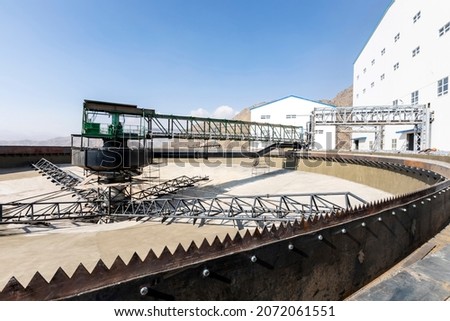 Concrete thickiner for mining plant. The discharge rate of underflow slurry is manipulated to maintain a steady solids inventory in the thickener.