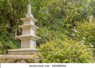 Concrete Three Story Pagoda On Concrete Plinth In Park.