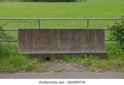 Concrete Traffic Barrier Blocking An Entrance To A Field In Rural Devon, England, UK