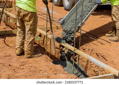 Concrete trenches are poured as foundation for a house, and are used as the foundation in construction area
