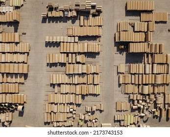 Concrete Tubes. Industrial Storage Place Of Round Concrete Elements. Aerial View Of Industrial Place.