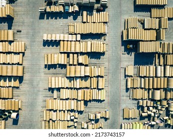 Concrete Tubes. Industrial Storage Place Of Round Concrete Elements. Aerial View Of Industrial Place.