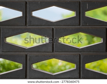 Concrete Ventilation Wall Pattern With Green Nature Background