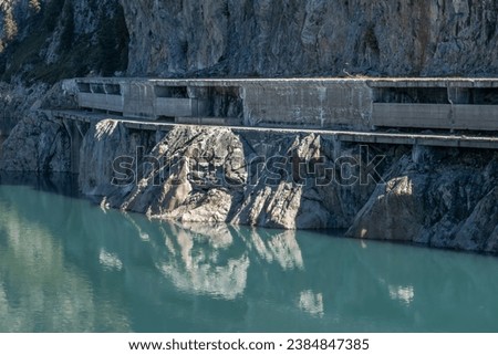 Concrete walkways on mountain side over the Emosson hydroelectric dam in the Alps in Switzerland