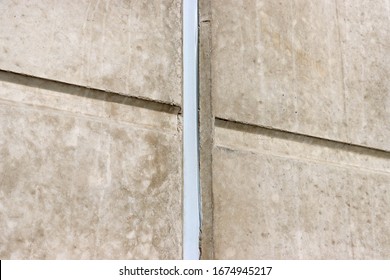 Concrete Wall. Concrete  Expansion  Joints. Polyurethane Putty Sealant