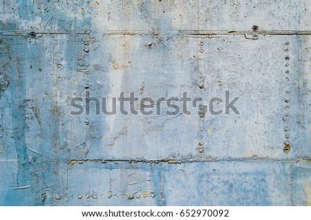 Concrete wall texture as background surface. Architecture details. Blue and gray concrete wall. Imprint from formwork on a concrete wall