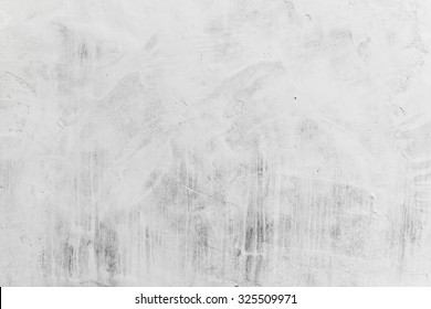 Concrete wall with whitewash layer, background photo texture