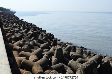 Concrete Wave Breakers Along Promenade On Coastline Near Marine Drive Road. Back Bay Is Part Of Arabian Sea Near Mumbai, India.