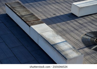 Concrete White Bench Block And Wave Shape In The Park On A Dark Cobbled Square, Clean Concrete Surface Gray Brown White Pedestrian And Rest Area At The Skate Park For Young People, Teenagers