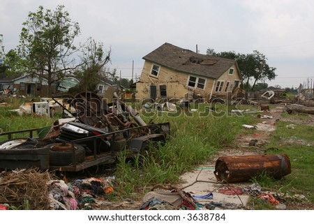 A condemned home and other debris in the 9th Ward of New Orleans, Louisiana, damaged in Hurricane Katrina.