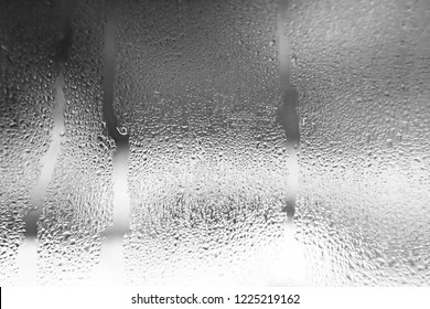 Condensate On The Glass Is Black, Moist Texture Of Water, Steam, Rain Outside The Window. Natural Background. Abstract Wallpaper