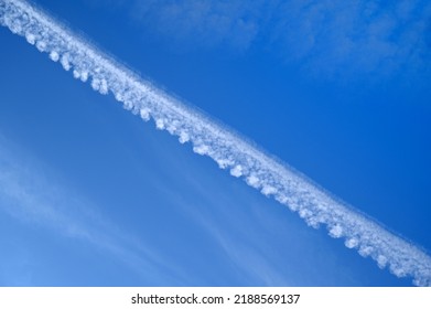 Condensation Trail Left By An Airplane And Called Cirrus Homogenitus 