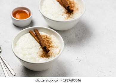 Condensed milk  rice pudding in bowls. Space for text.