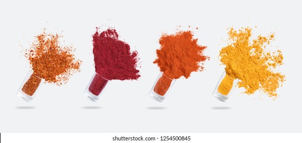 Condiments explosion. Glass jars with various spices flying isolated on white background, panorama