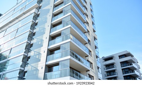 Condominium and apartment building with  symmetrical modern architecture in the city downtown. - Shutterstock ID 1923923042
