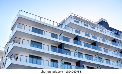 Condominium and apartment building with  symmetrical modern architecture in the city downtown. - Shutterstock ID 1924249958