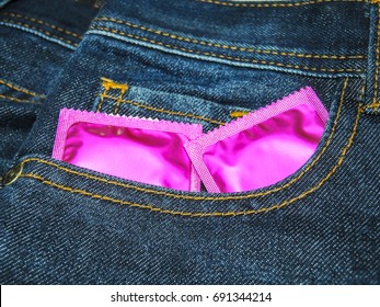 Condoms for sex.Jeans background.A good image to use.Close shot.