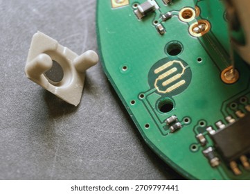 Conductive rubber button and contact surface on electronic circuit board. 