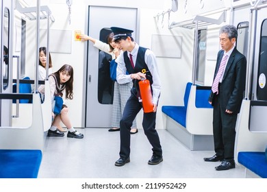 Conductor Extinguishing A Fire In A Train Car