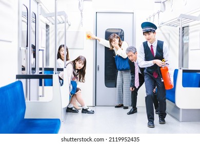 Conductor Extinguishing A Fire In A Train Car