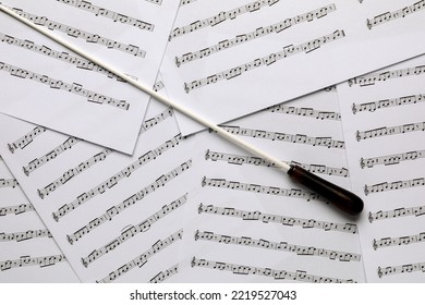 Conductor's Baton On Sheet Music, Flat Lay