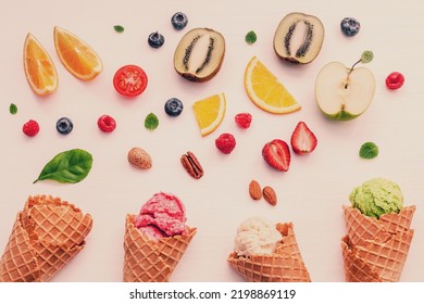 Cones And Colorful Various Fruits Raspberry ,blueberry ,strawberry ,orange Slice , Half Kiwi ,apple,tomato And Peppermint Leaves Setup On White Background . Summer And Sweet Menu Concept Flat Lay.