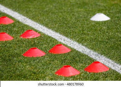 Cones For Football Training On Green Grass