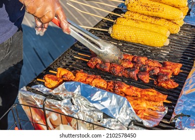 Coney Island, Brooklyn, New York City, New York, USA. Meat Kebabs And Corn On The Cob At A Sidewalk Food Stand.