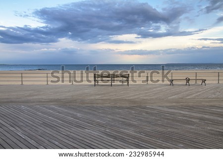 Coney Island empty boardwalk with bench, Brighton beach, Brooklyn, New York