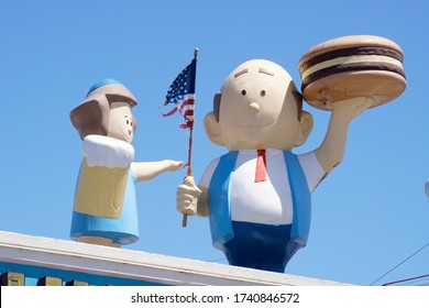 Coney Island, NY / USA - May 23, 2020: Coney Island's Famed Boardwalk Is Home To Many Colorful Signs, Billboards And Statues Advertising Local Food Stands, Carnival Shows And Amusement Parks.