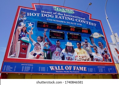 Coney Island, NY / USA - May 23, 2020: Coney Island's Famed Boardwalk Is Home To Many Colorful Signs, Billboards And Statues Advertising Local Food Stands, Carnival Shows And Amusement Parks.