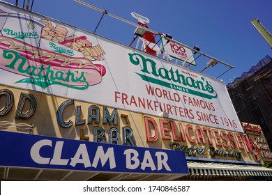 Coney Island, NY / USA - May 23, 2020: Coney Island's Famed Boardwalk Is Home To Many Colorful Signs, Billboards And Statues Advertising Local Food Stands, Carnival Shows And Amusement Parks.