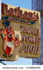 Coney Island, NY / USA - May 23, 2020: Coney Island's Famed Boardwalk Is Home To Many Colorful Signs, Billboards And Statues Advertising Local Food Stands, Carnival Shows And Amusement Parks.