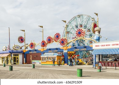 CONEY ISLAND, USA - OCT 25, 2015: people visit famous old promenade at Coney Island, the amusement beach zone of New York.